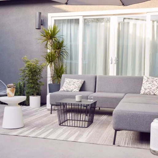 Outdoor Seating And Garden Furniture On Patio Of Contemporary Home