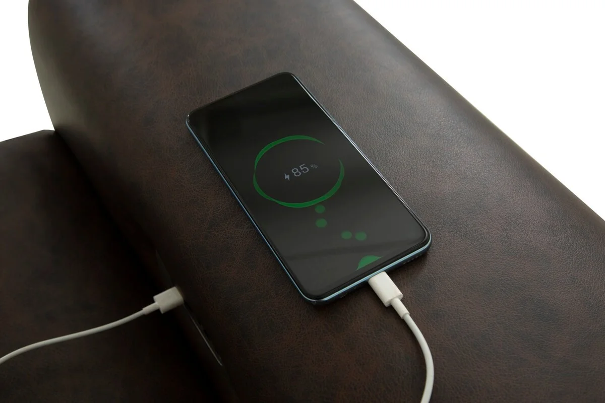 1200x4096r0-1 copy closeup of sofa arm with iphone charging from usb port