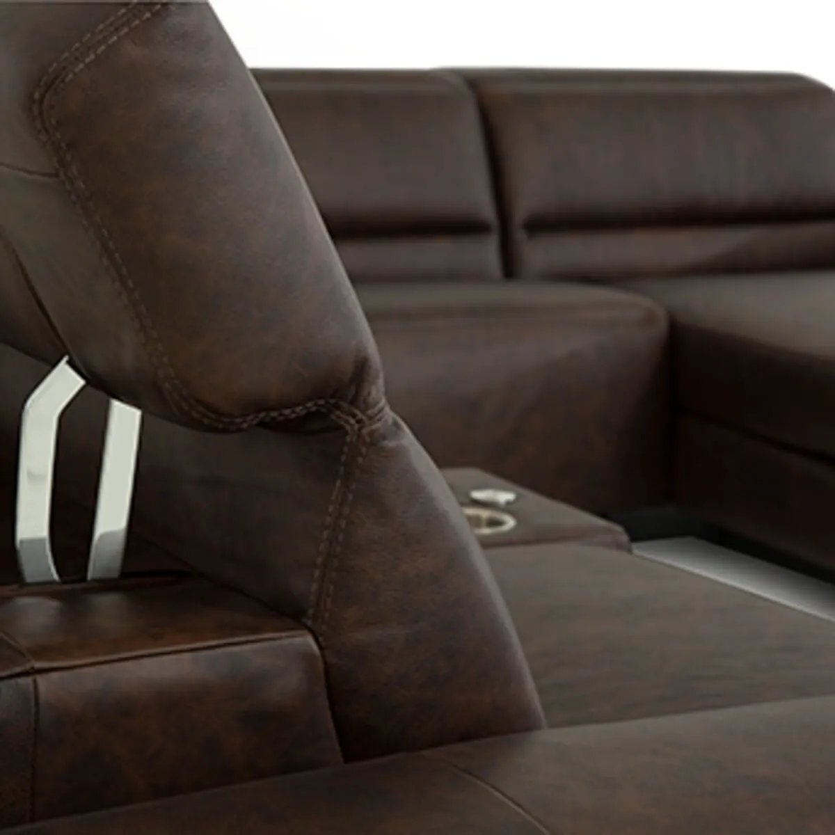 1200x4096r0-4 copy close up of power reclining headrest on chocolate color leather sectional showing stainless steel mechanism
