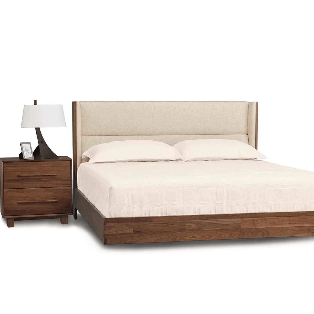 sloane2 Modern floating walnut platform bed with upholstered headboard in a cream fabric and two drawer nighstand.