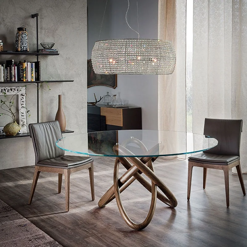 Carioca dining table round in a showroom with elegant chairs by Cattelan italia.