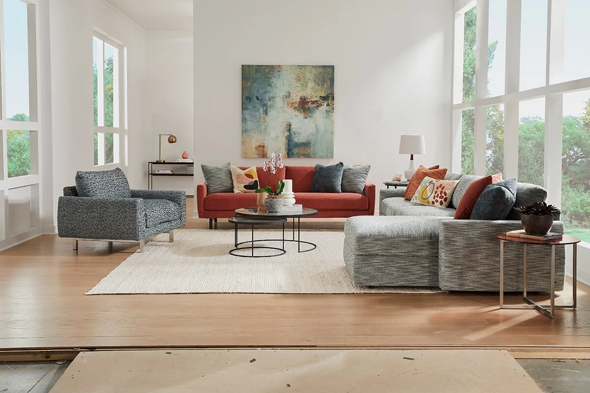 ED.EsteroSectional_BodieEucalyptus_EsteroChairandhalf_SaberMineral_CarmetSo2_PiperSangria_Lifestyle_No_Art staged living room shot