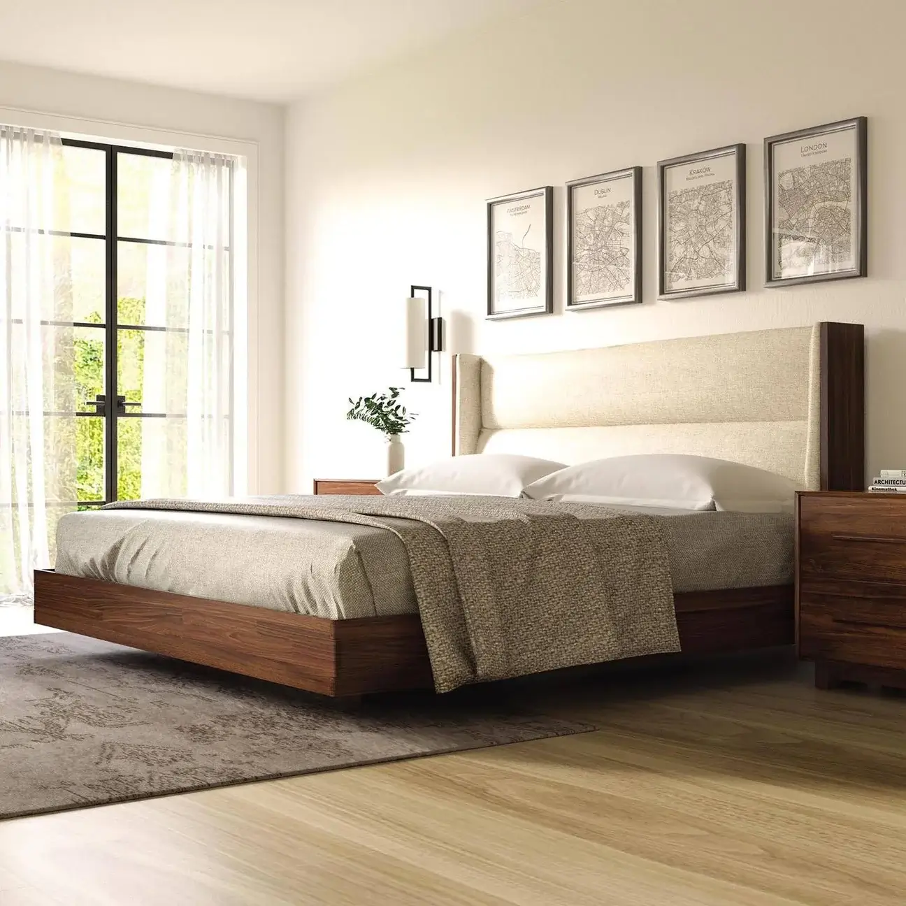 SloanBedroomWalnut_1296x Modern floating walnut platform bed with upholstered headboard in a cream fabric in an empty sunlit room.