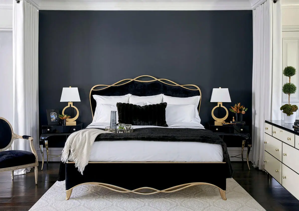sig-416-123-rs-hr Transitional bedroom furnished with a black ribbon bed by Caracole in a black velvet fabric with a gold finish wood trim in a ribbon like form.