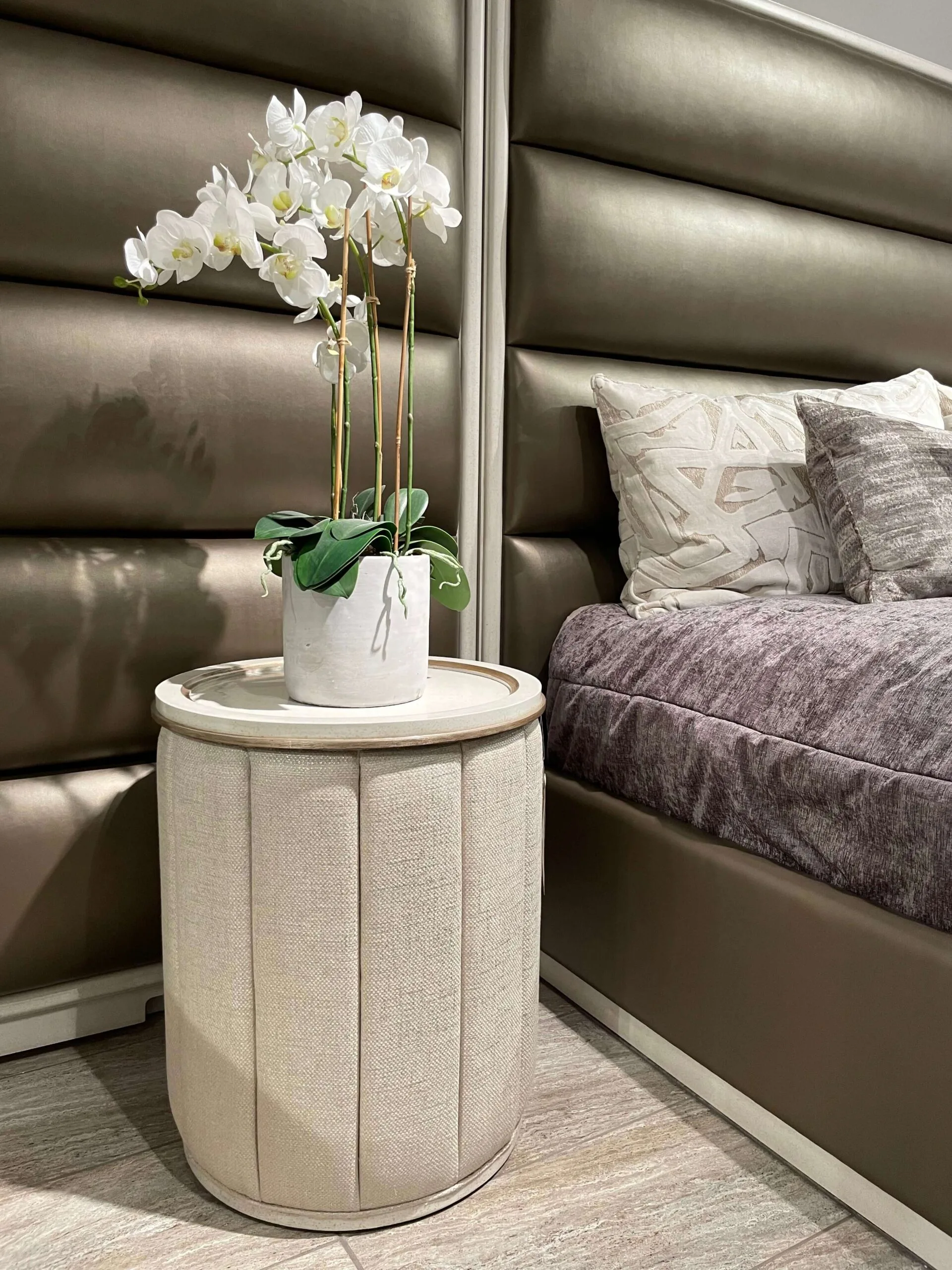 IMG_7212_copy palo alto bed by marge carson with side panels in a bronze material and white wood trim closeup