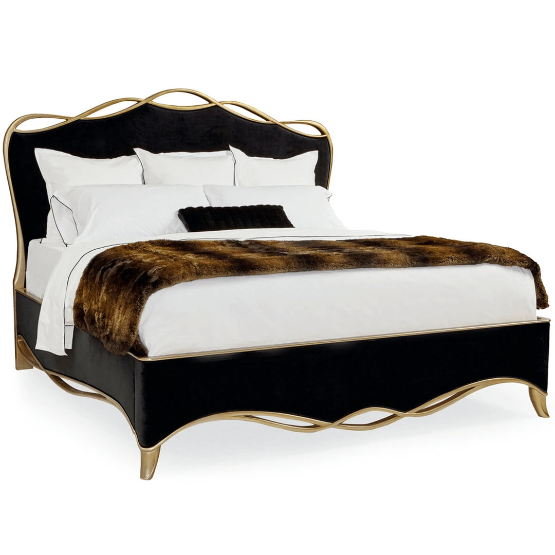 ribbon1 The black ribbon bed by Caracole in a black velvet fabric with a gold finish wood trim in a ribbon like form.