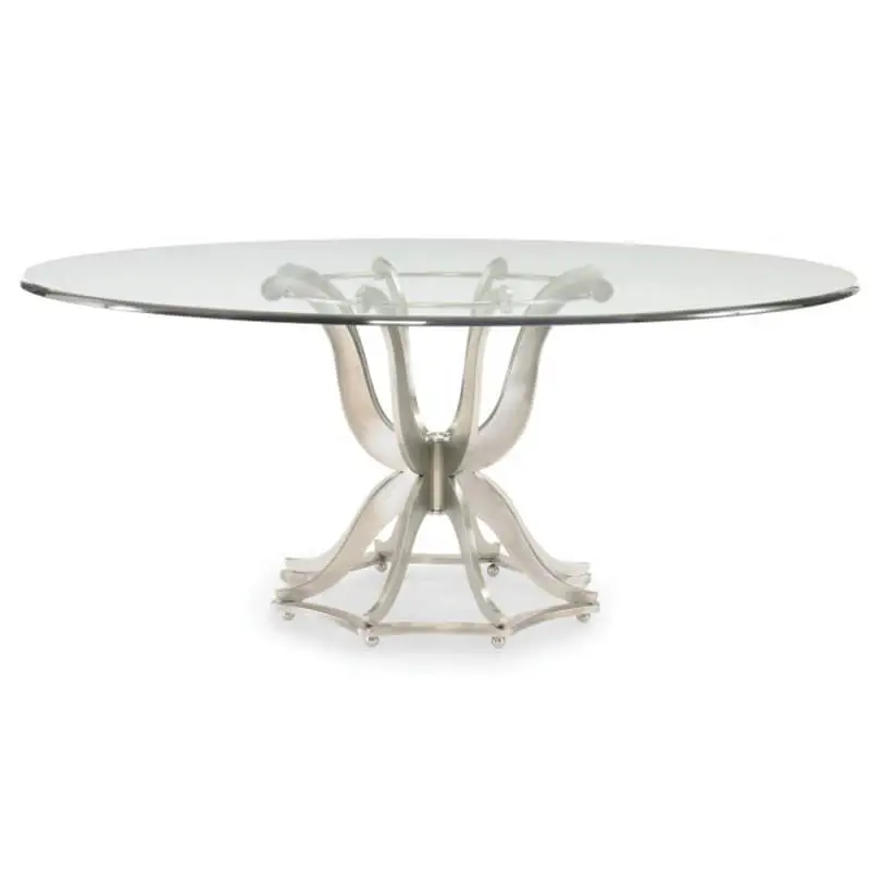 Round dining table with glass top side view. Its base is truly unique: eight serpentine shaped polished aluminum "arms" reach upward to support the round 3/4 inch glass top, while eight "legs" reach downward to rest on a concave-sided, octagonal base.