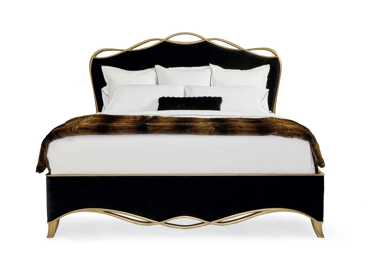 sig-416-123-front-hr The black ribbon bed by Caracole in a black velvet fabric with a gold finish wood trim in a ribbon like form.