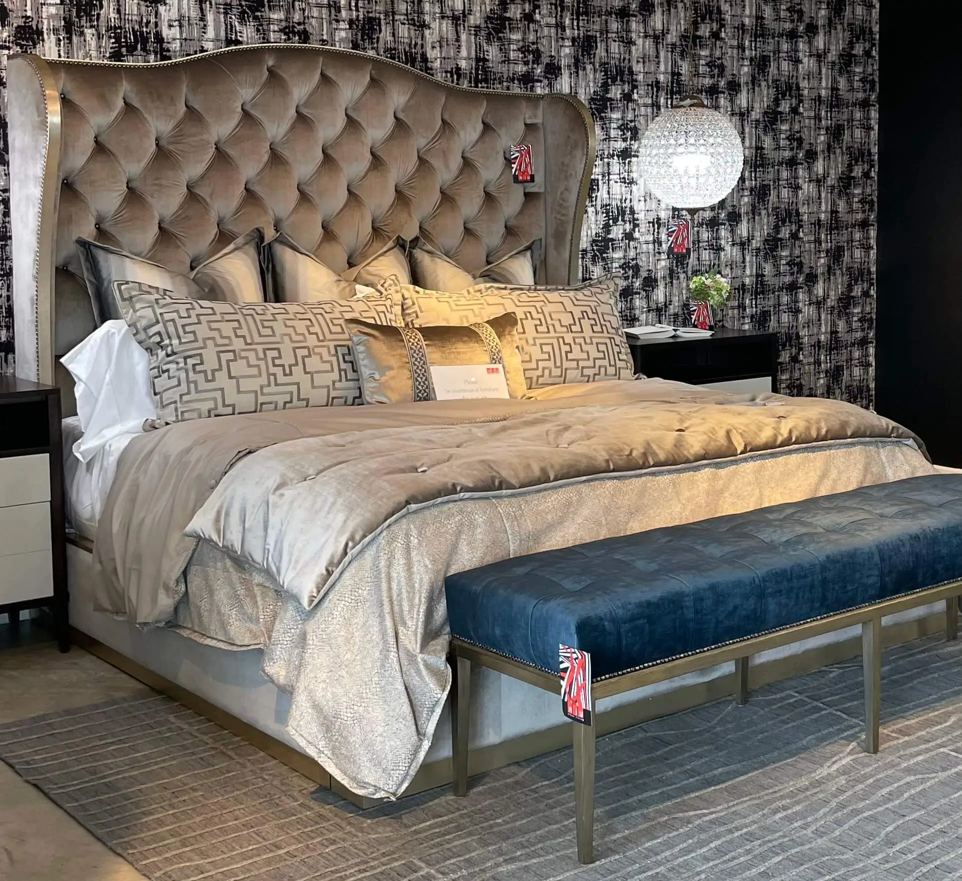 a traditional bed with the tufted headboard in a purplish fabric